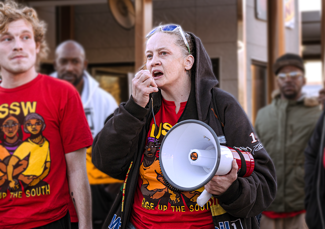 USSW member Steffany Blinn speaks into a megaphone at a strike in South Carolina