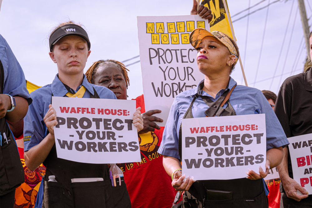 Waffle House workers stand in protest outside of a Waffle House restaurant in South Carolina
